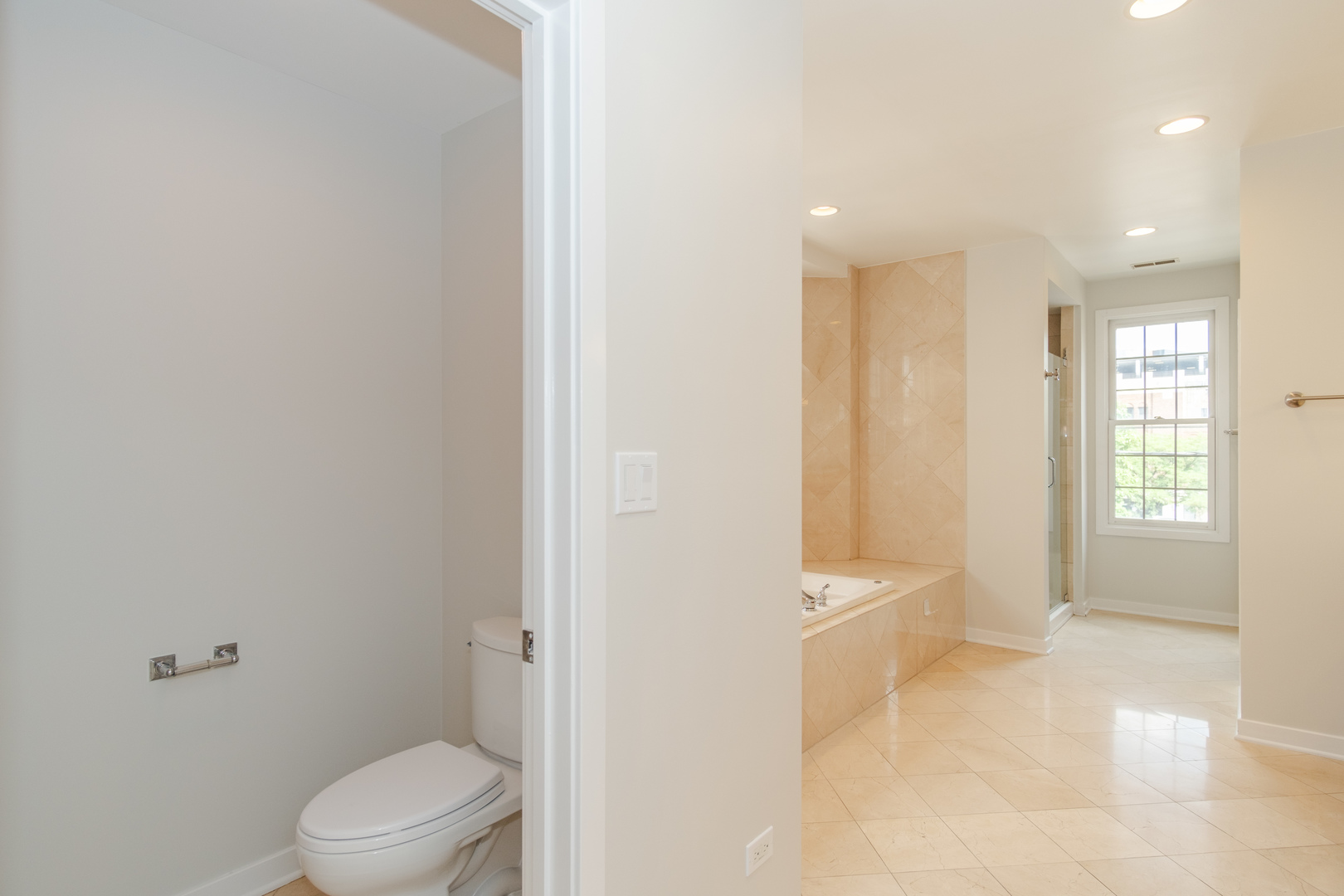 24 North Ada Street, Unit I Chicago, IL 60607 - Photo 20 of 29 a bathroom with a granite countertop sink a toilet and shower