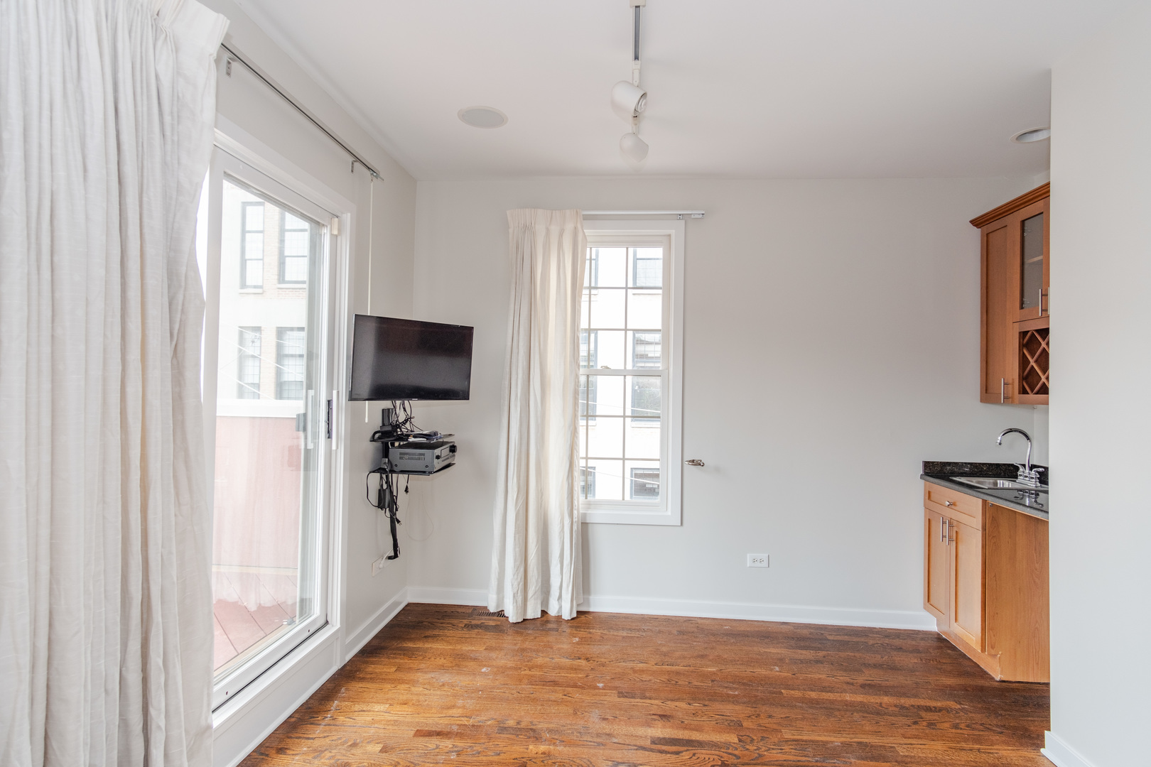 24 North Ada Street, Unit I Chicago, IL 60607 - Photo 22 of 29 a view of a livingroom with a window and hardwood floor