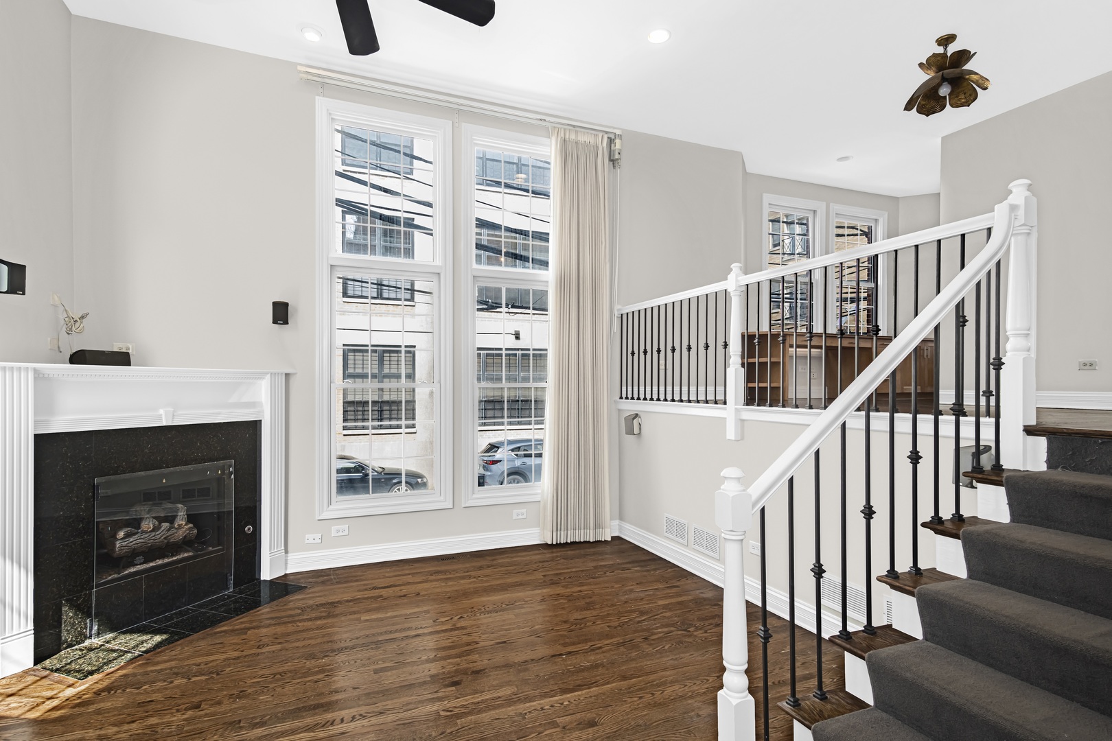 24 North Ada Street, Unit I Chicago, IL 60607 - Photo 3 of 29 a view of an empty room with wooden floor fireplace and a window