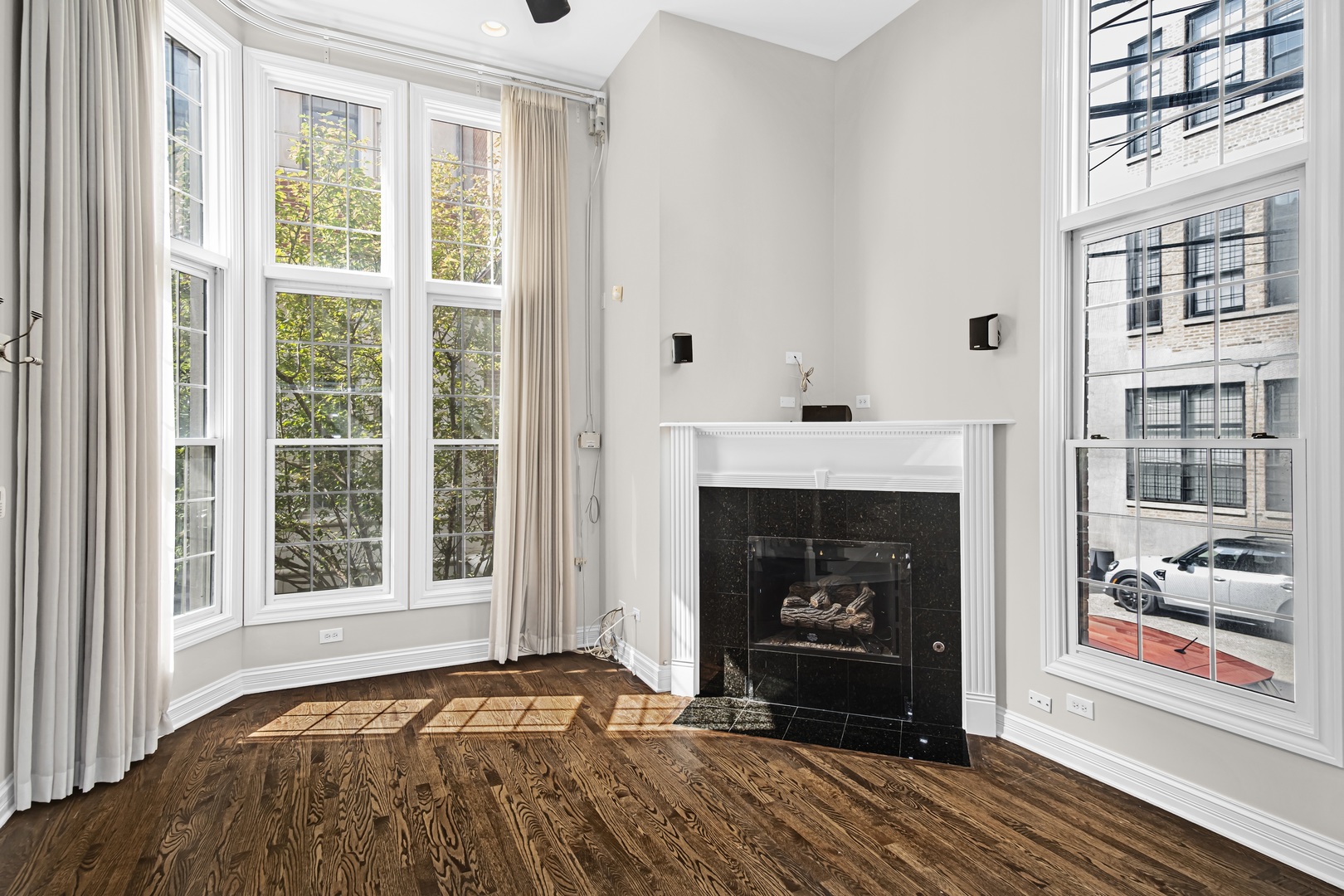 24 North Ada Street, Unit I Chicago, IL 60607 - Photo 4 of 29 a view of an empty room with a fireplace and a window