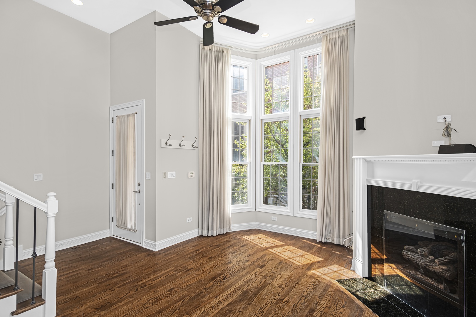24 North Ada Street, Unit I Chicago, IL 60607 - Photo 5 of 29 a bedroom with a bed and a fireplace