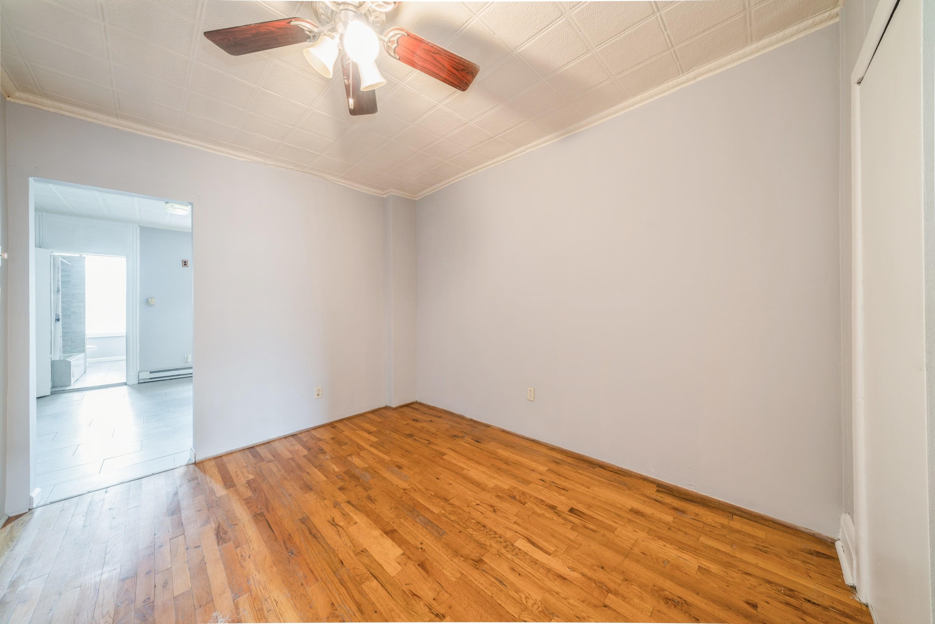 407 4th Street, Unit 4R (6) Hoboken, NJ 07030 - Photo 12 of 17 a view of empty room with wooden floor