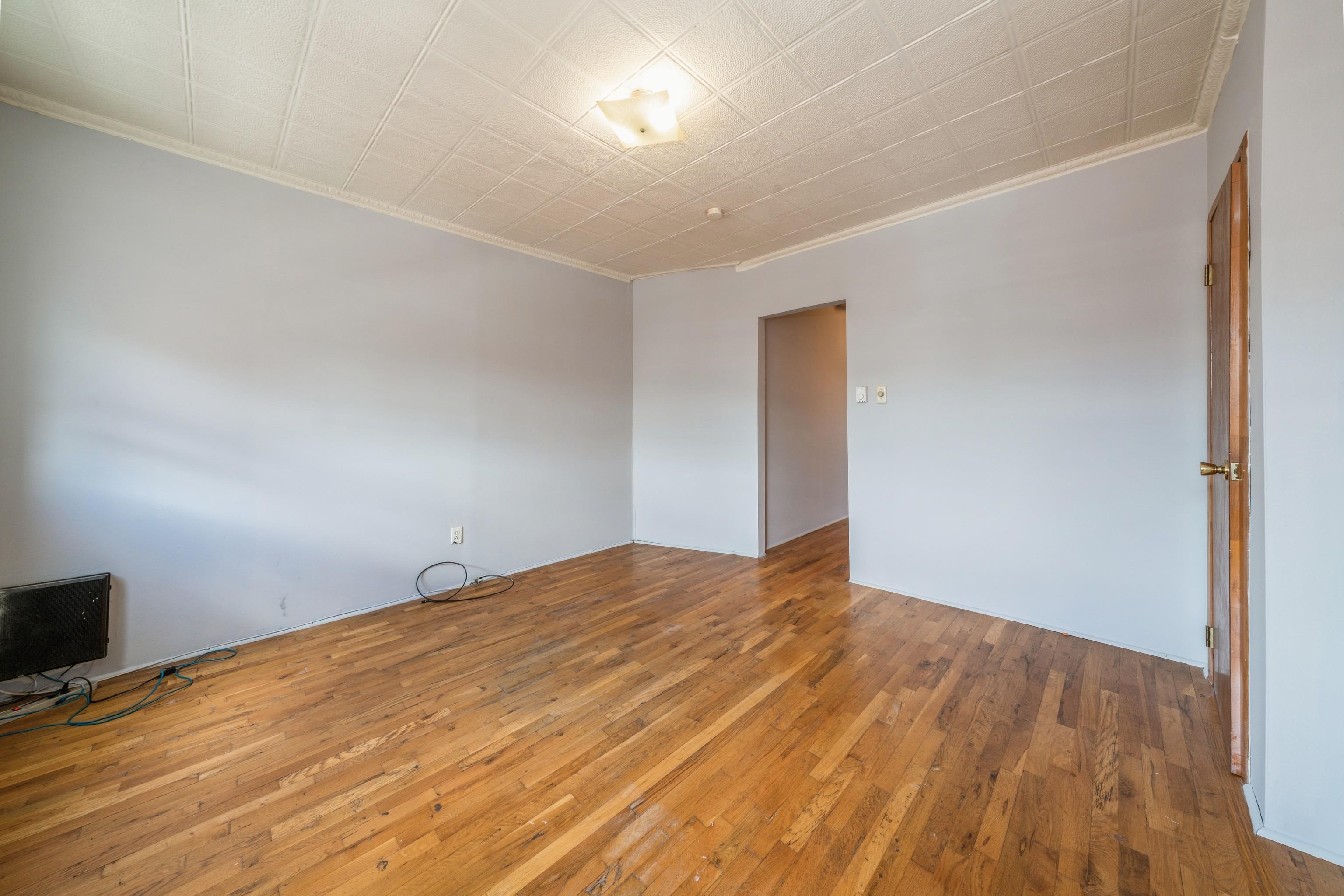 407 4th Street, Unit 4R (6) Hoboken, NJ 07030 - Photo 15 of 17 a view of empty room with wooden floor
