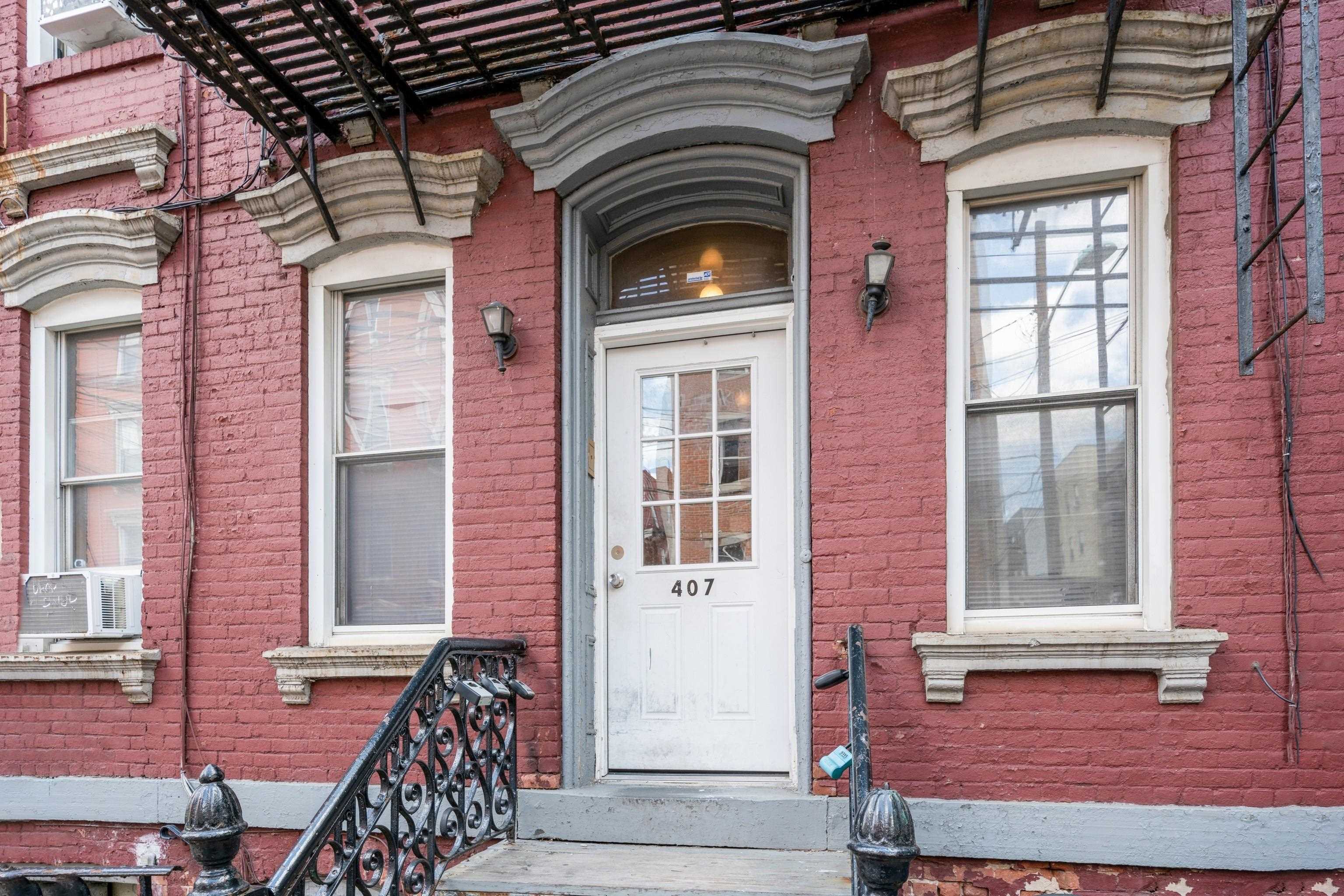 407 4th Street, Unit 4R (6) Hoboken, NJ 07030 - Photo 17 of 17 a front view of a house with a porch
