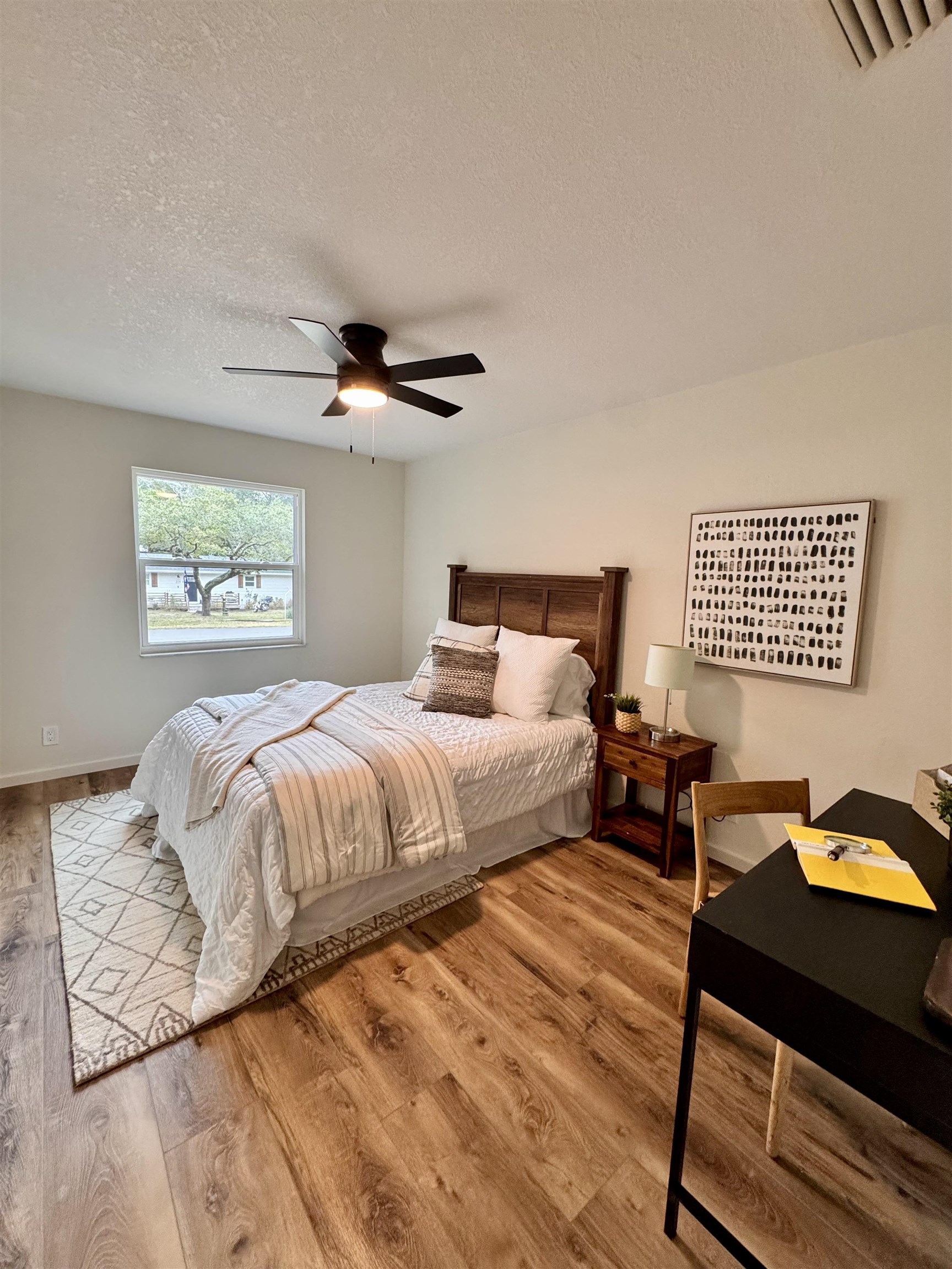 226 Jasmine Road St. Augustine, FL 32086 - Photo 12 of 20 a bedroom with a bed and a chandelier