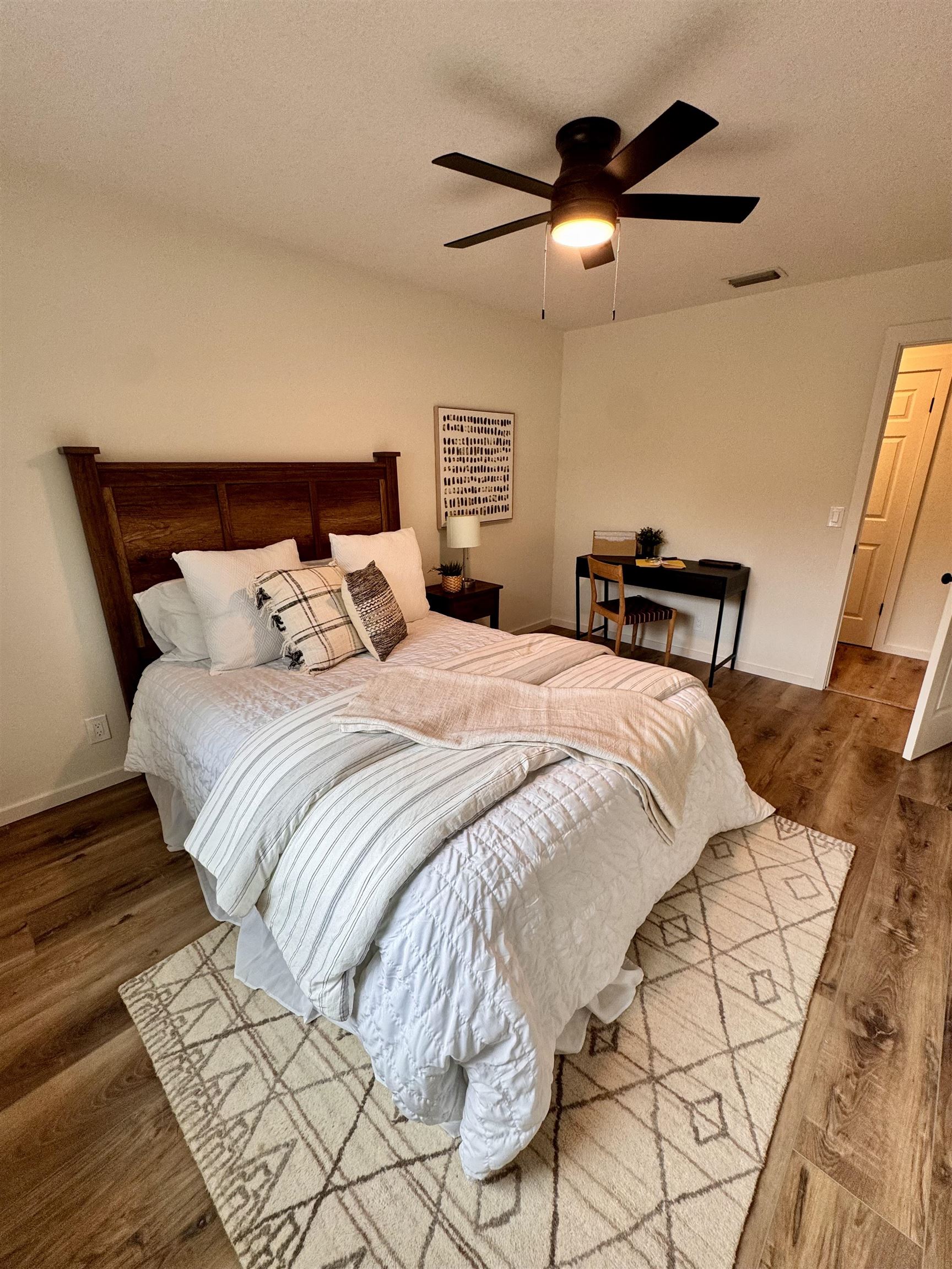226 Jasmine Road St. Augustine, FL 32086 - Photo 13 of 20 a bedroom with bed and a chandelier