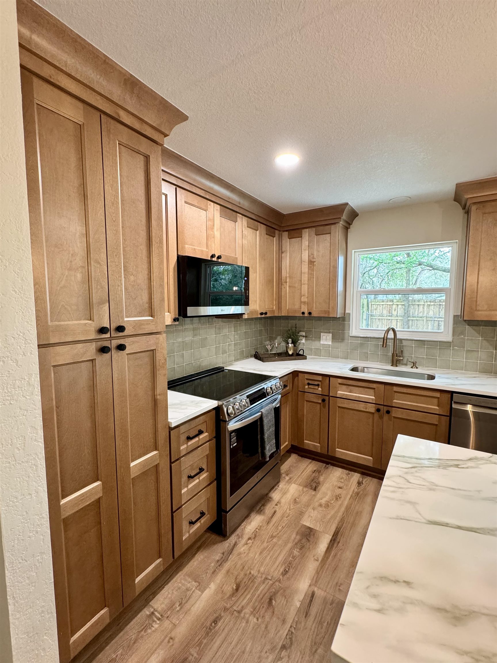 226 Jasmine Road St. Augustine, FL 32086 - Photo 8 of 20 a kitchen with granite countertop stainless steel appliances a stove sink and microwave