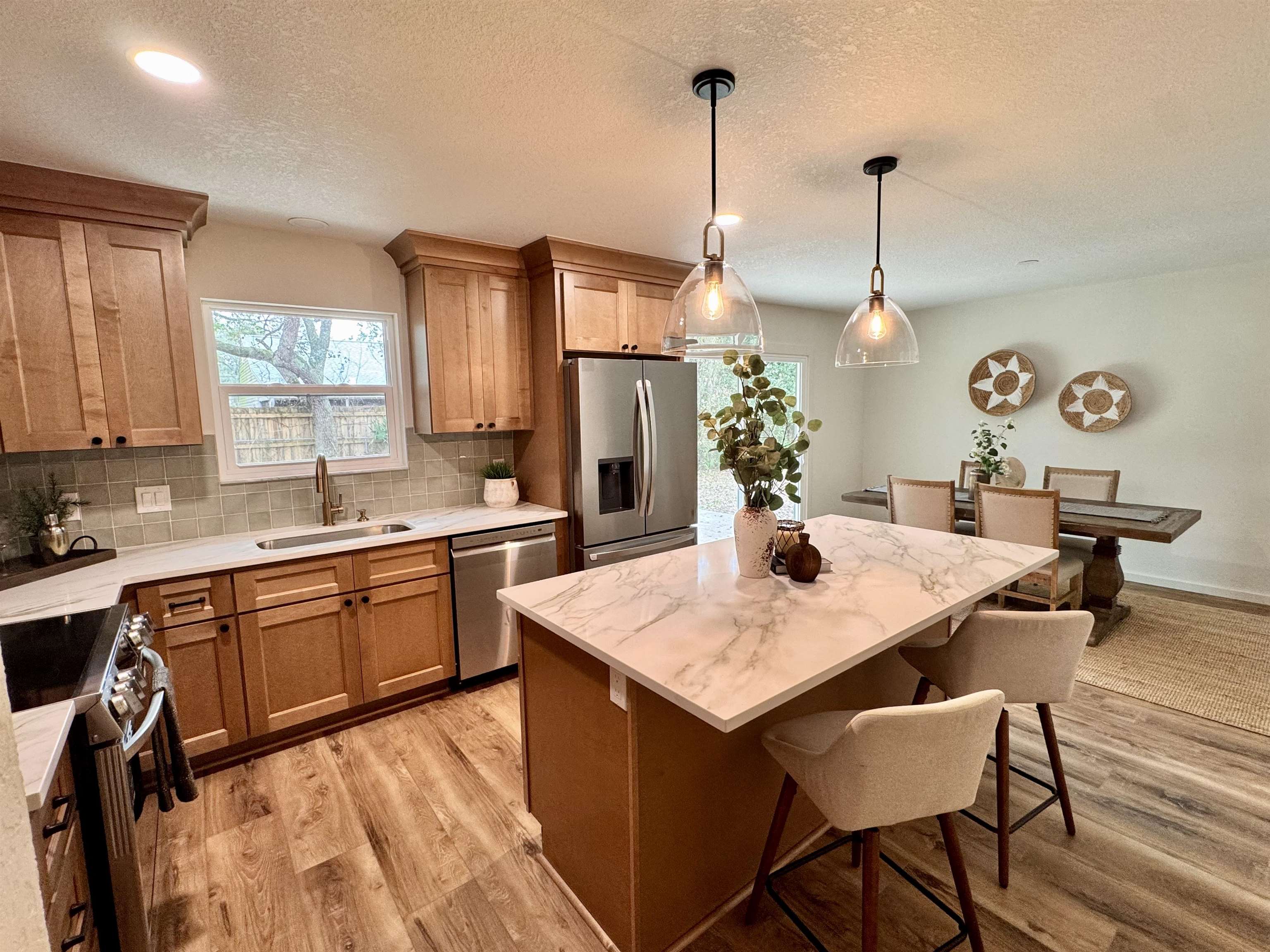 226 Jasmine Road St. Augustine, FL 32086 - Photo 9 of 20 a kitchen with a table chairs sink and cabinets