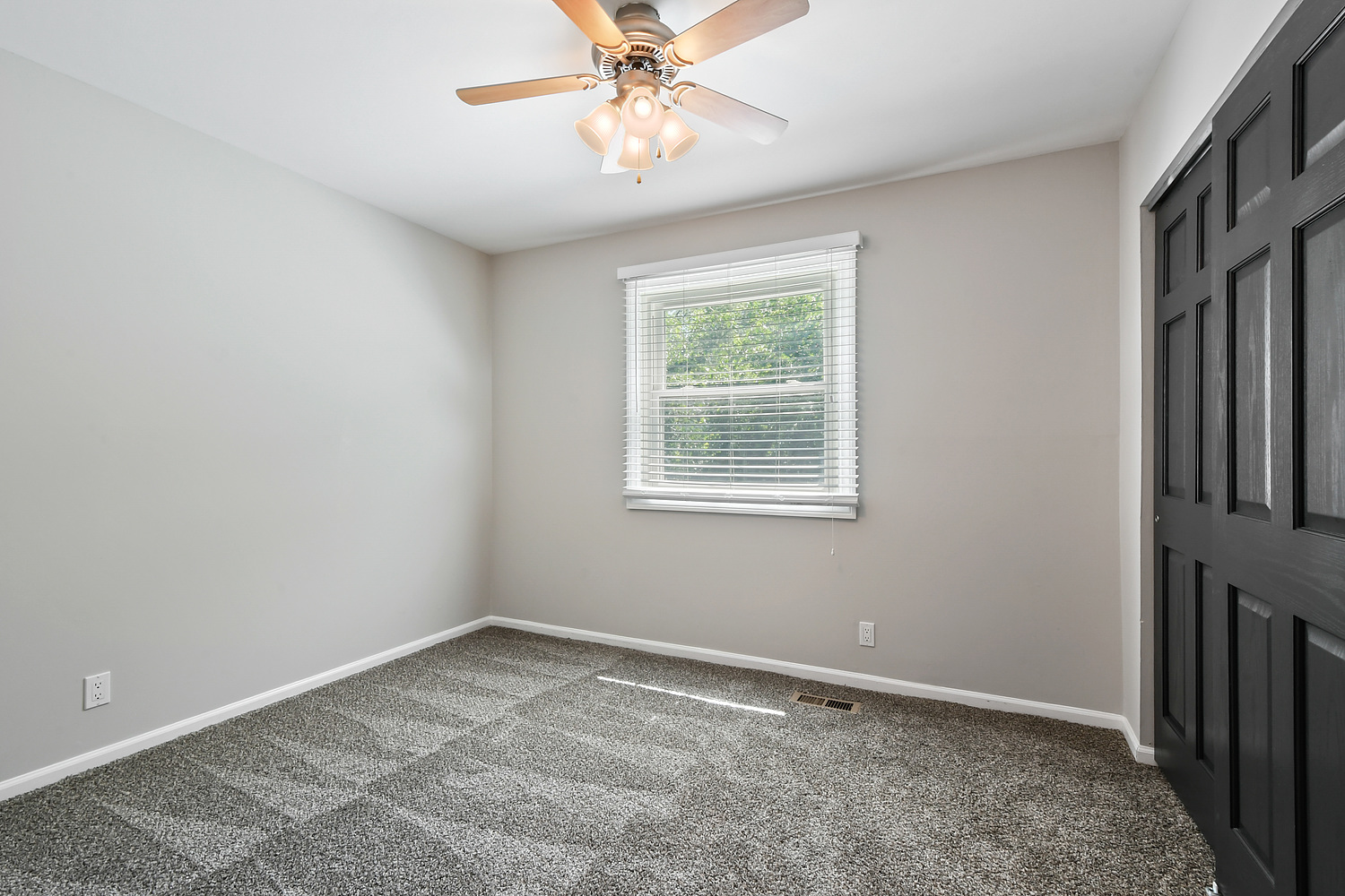 135 Thornhurst Road Bolingbrook, IL 60440 - Photo 13 of 15 an empty room with windows and fan
