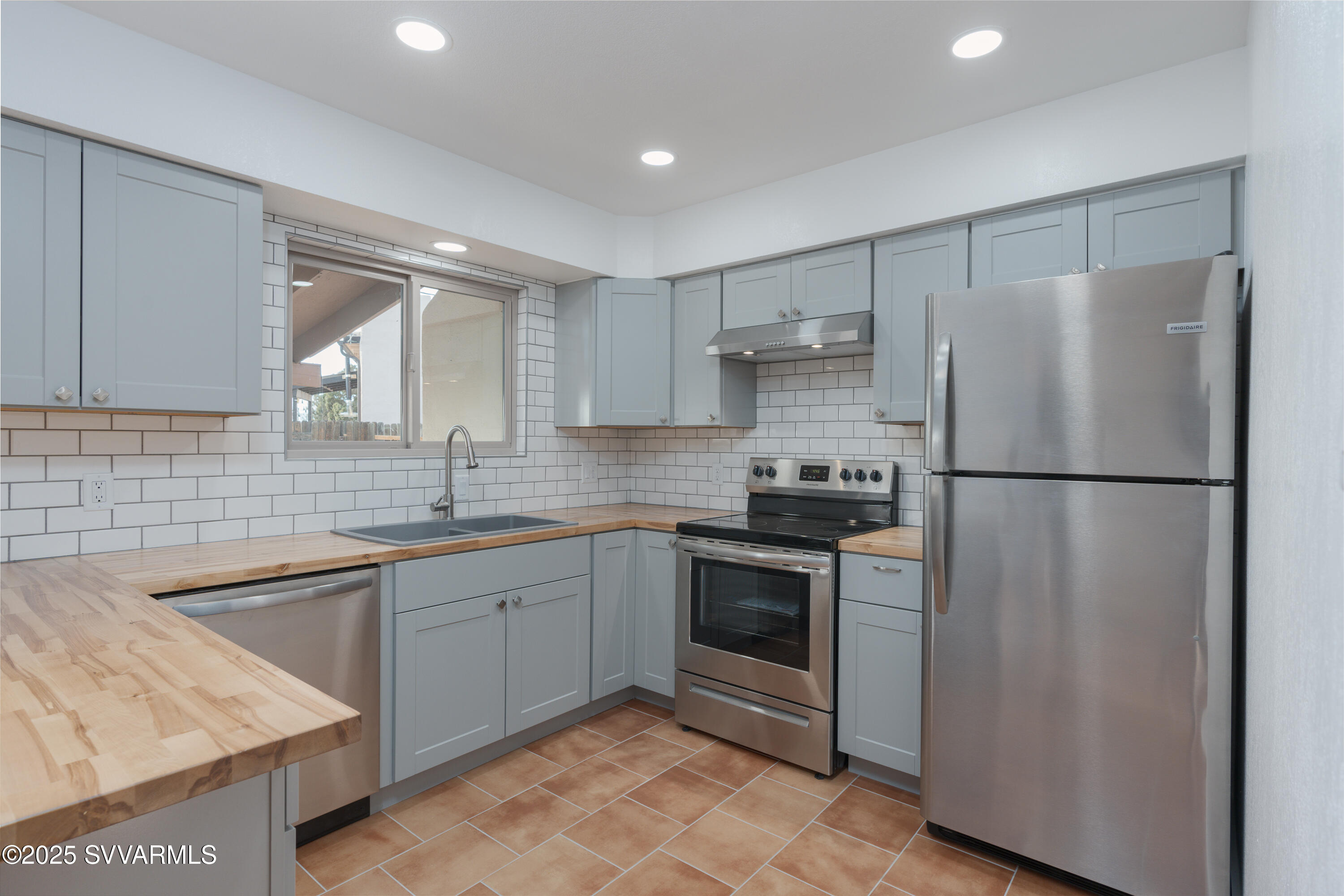 4875 East Mallard Drive Rimrock, AZ 86335 - Photo 22 of 36 a kitchen with stainless steel appliances granite countertop a refrigerator sink and stove