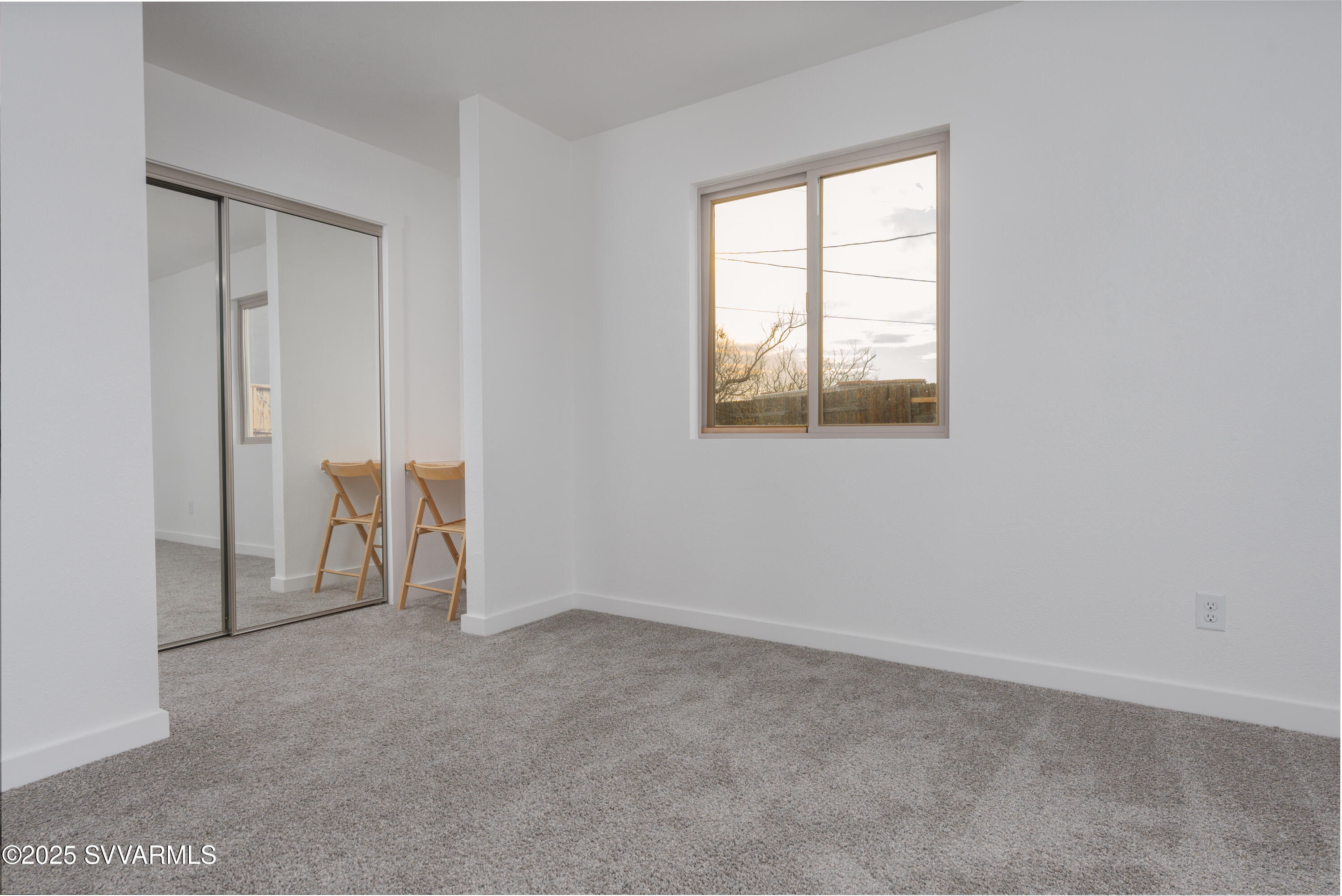 4875 East Mallard Drive Rimrock, AZ 86335 - Photo 25 of 36 an empty room with windows and closet