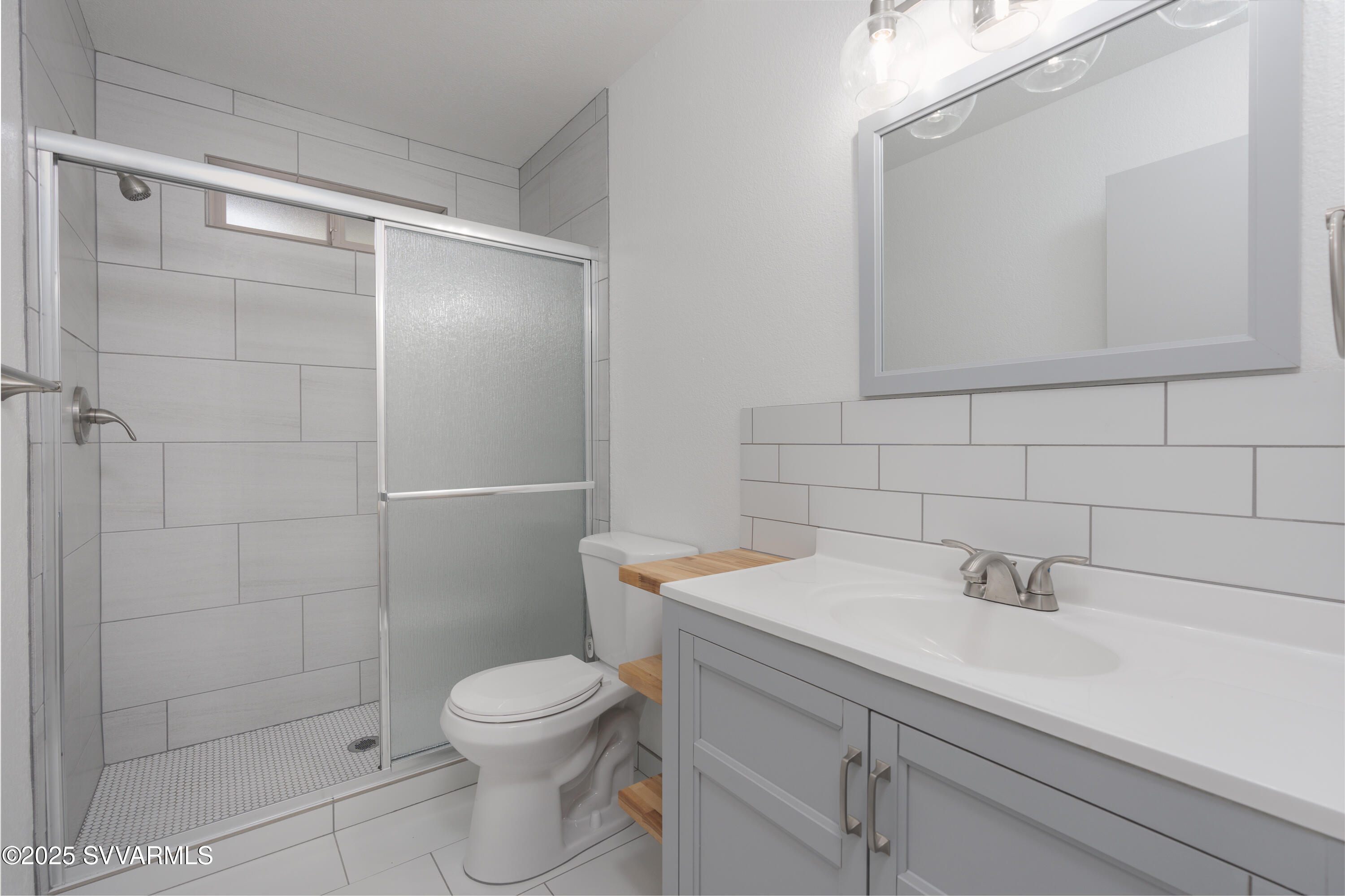 4875 East Mallard Drive Rimrock, AZ 86335 - Photo 27 of 36 a bathroom with a sink a toilet and shower