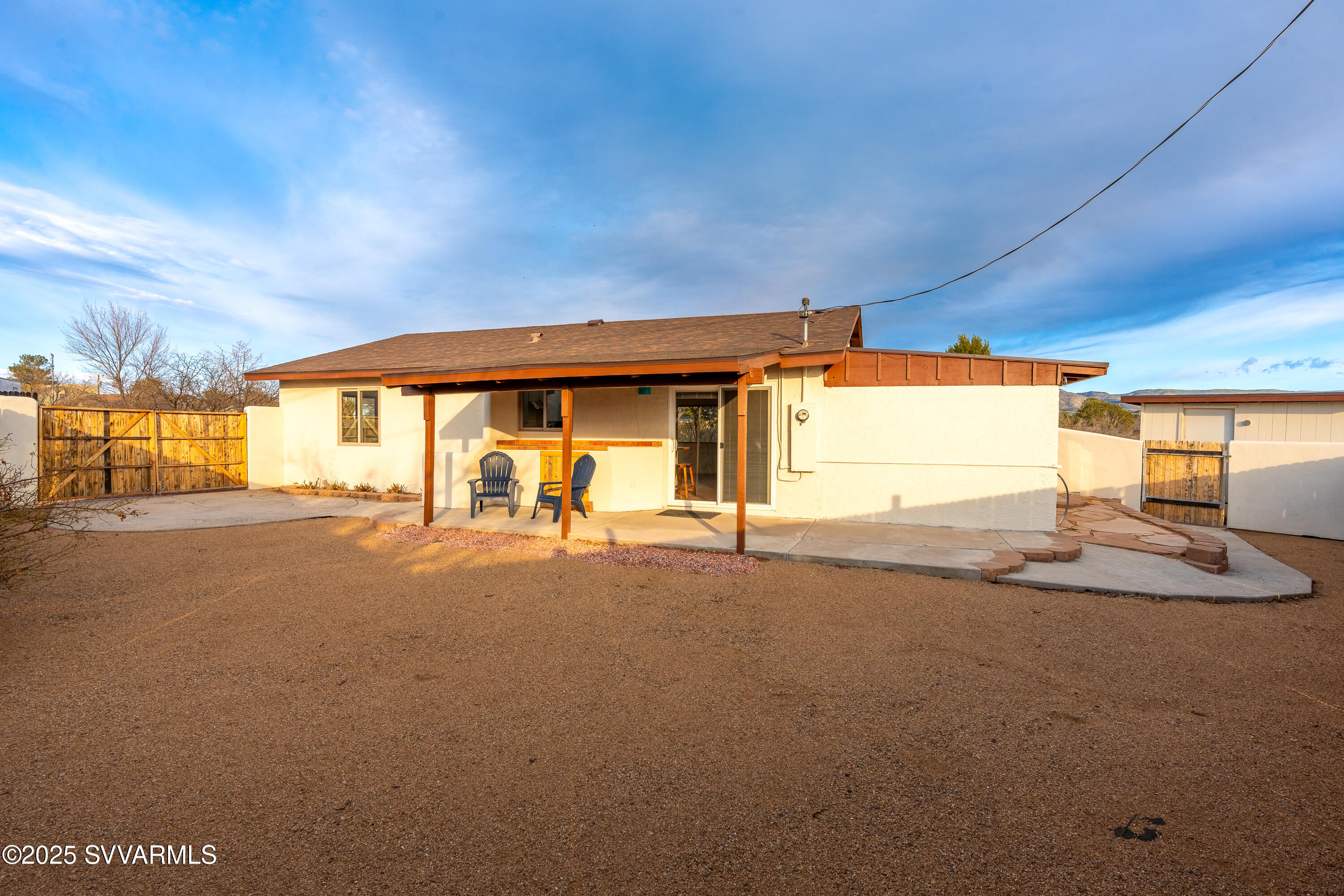 4875 East Mallard Drive Rimrock, AZ 86335 - Photo 29 of 36 a view of a house with a backyard and a garage