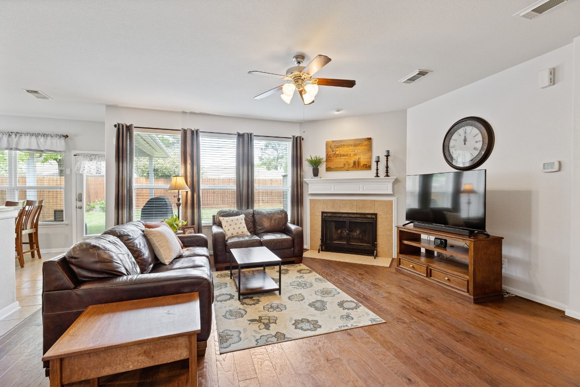 5318 Wisteria Brook Lane Spring, TX 77379 - Photo 11 of 50 a living room with furniture a fireplace and a large window