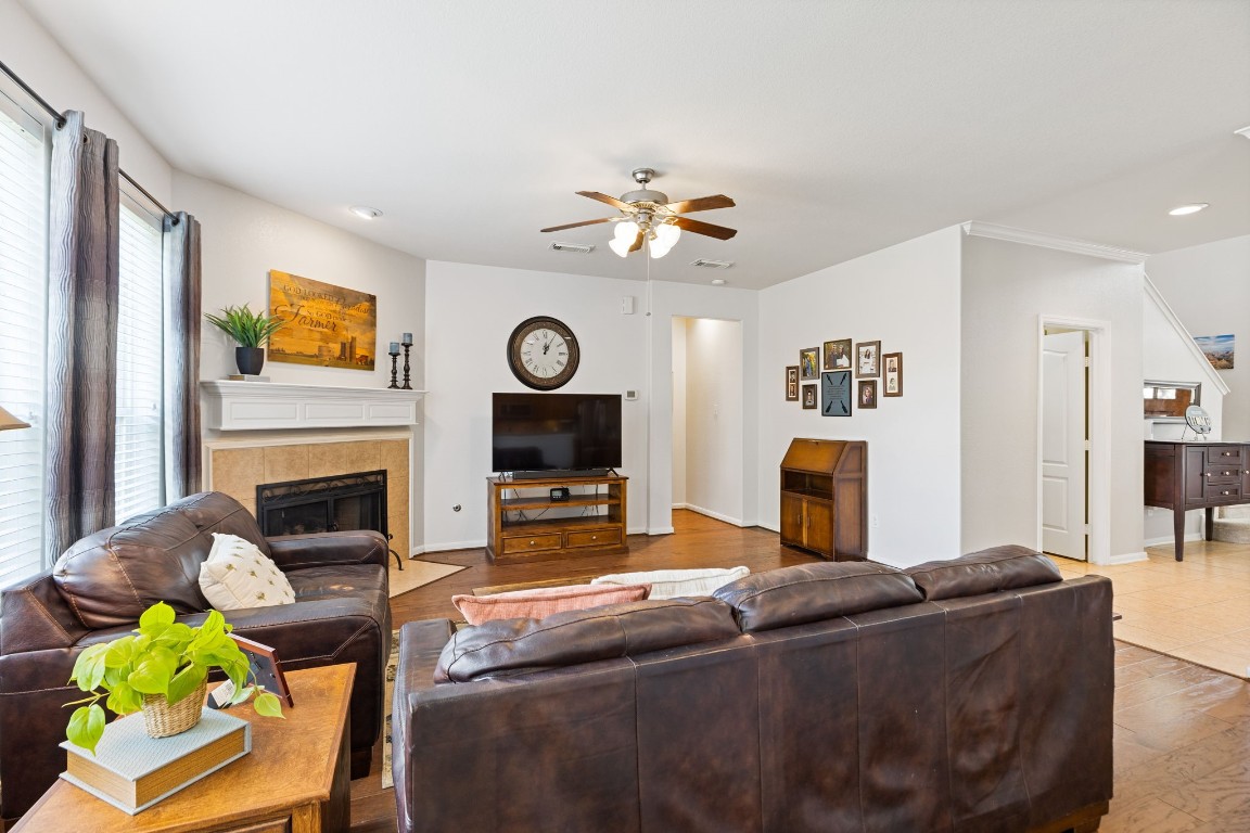 5318 Wisteria Brook Lane Spring, TX 77379 - Photo 13 of 50 a living room with furniture a fireplace and a flat screen tv