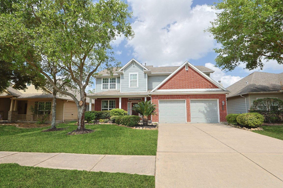 5318 Wisteria Brook Lane Spring, TX 77379 - Photo 2 of 50 front view of a house and a yard