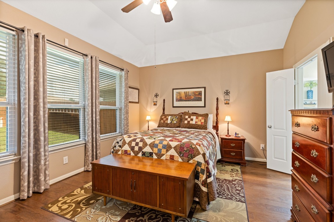 5318 Wisteria Brook Lane Spring, TX 77379 - Photo 20 of 50 a bedroom with a bed and wooden floor