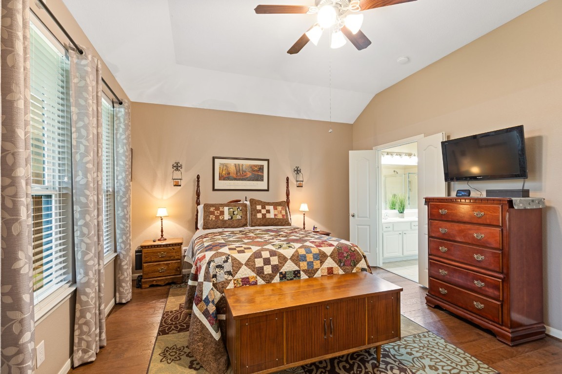 5318 Wisteria Brook Lane Spring, TX 77379 - Photo 21 of 50 a bedroom with a bed and a flat screen tv