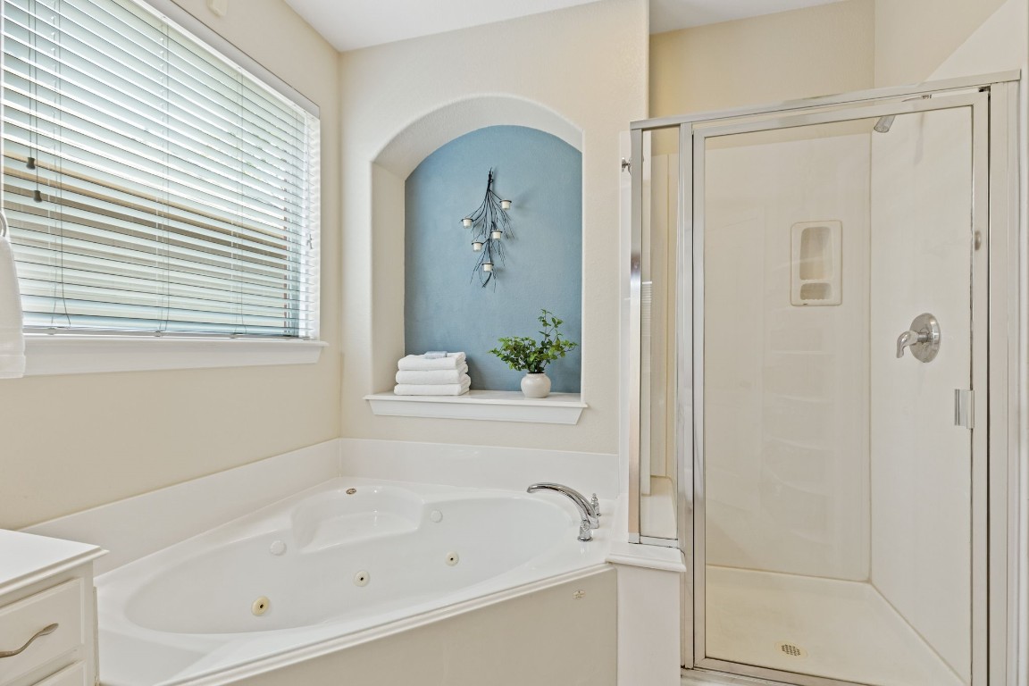 5318 Wisteria Brook Lane Spring, TX 77379 - Photo 23 of 50 a white bath tub sitting next to a white cabinet