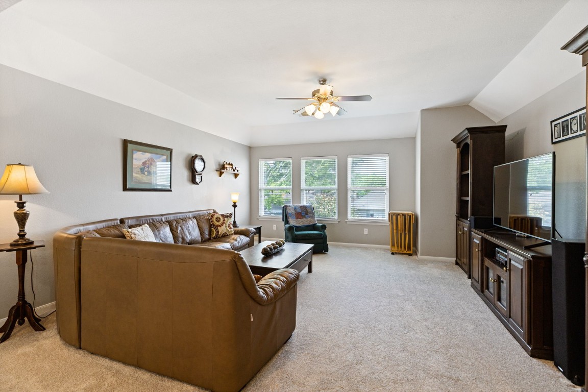 5318 Wisteria Brook Lane Spring, TX 77379 - Photo 24 of 50 a living room with furniture a window and a flat screen tv