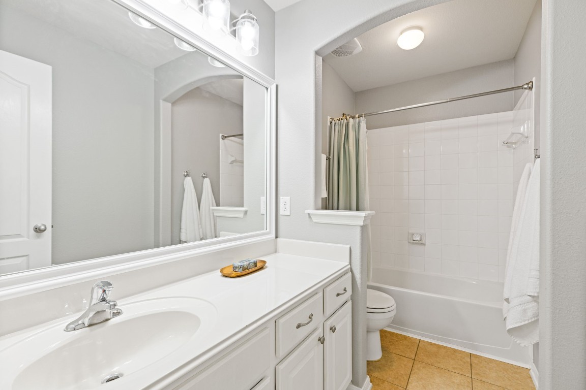 5318 Wisteria Brook Lane Spring, TX 77379 - Photo 32 of 50 a bathroom with a sink tub vanity and a mirror