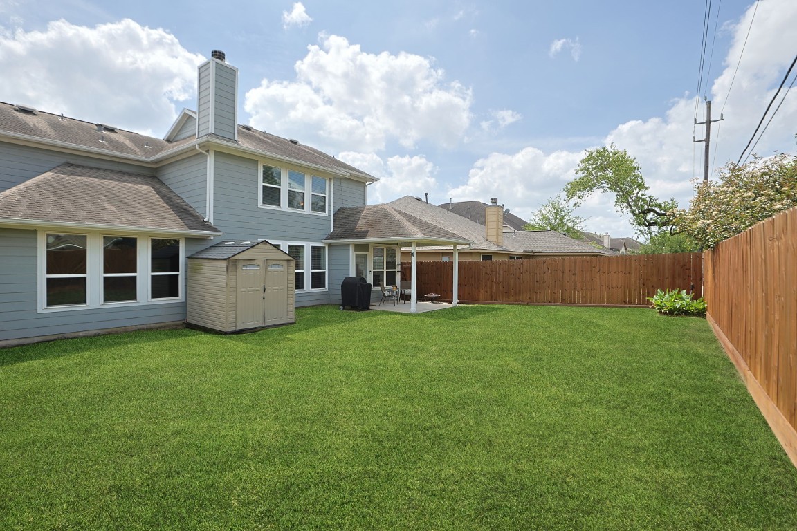5318 Wisteria Brook Lane Spring, TX 77379 - Photo 38 of 50 a view of a house with backyard and porch