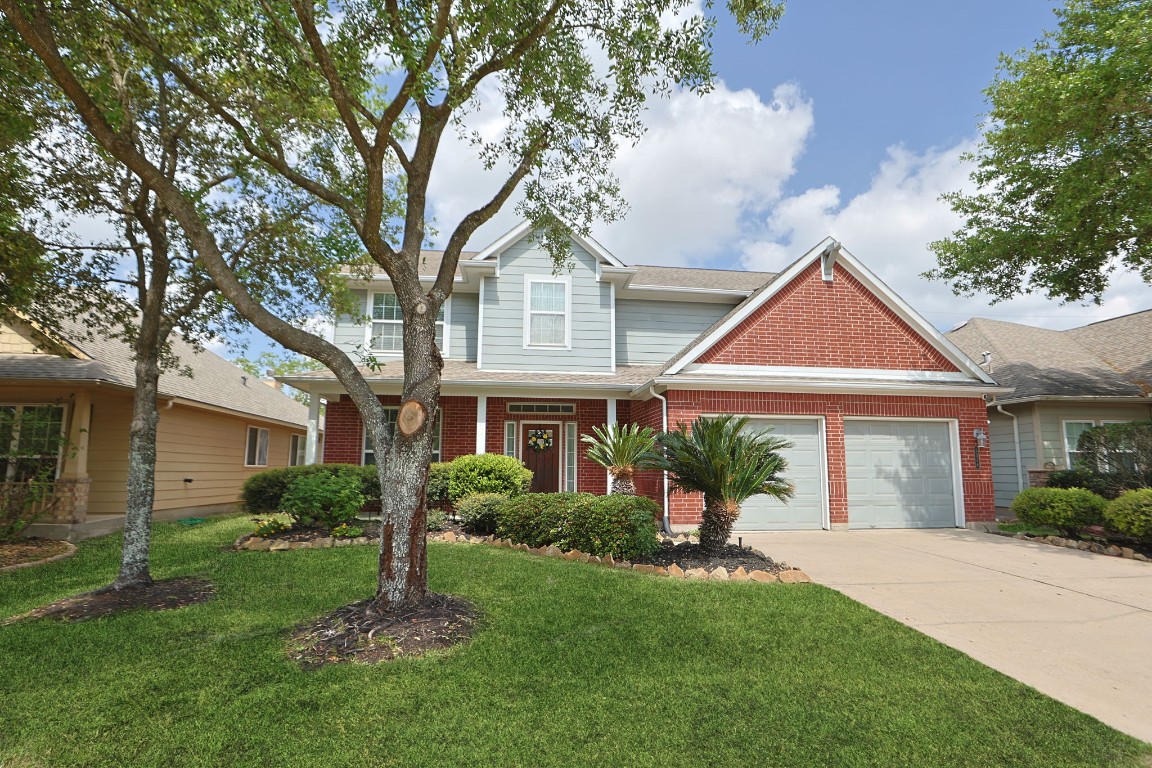 5318 Wisteria Brook Lane Spring, TX 77379 - Photo 4 of 50 a front view of a house with yard