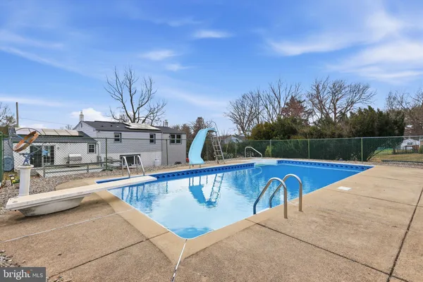 a view of a swimming pool with a patio