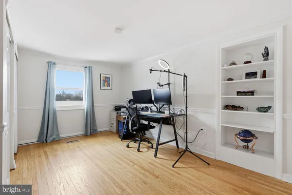 a workspace with furniture hardwood and a window