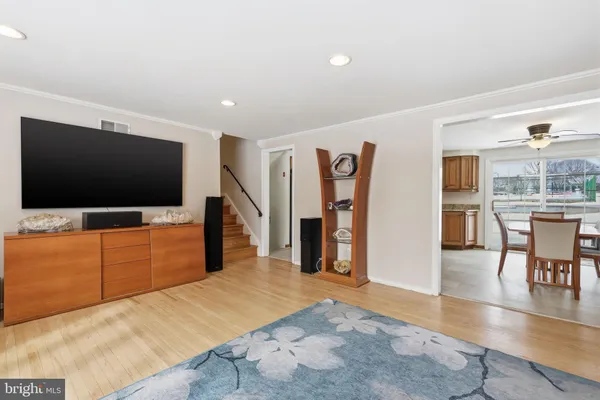 a bedroom with furniture and a flat screen tv