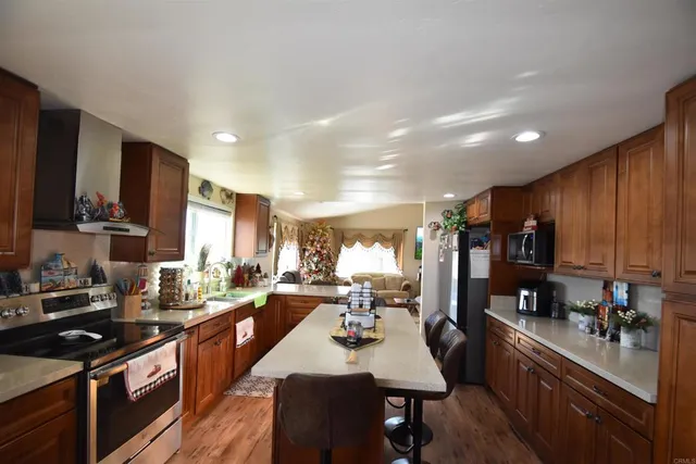 a view of a dining room with furniture and chandelier