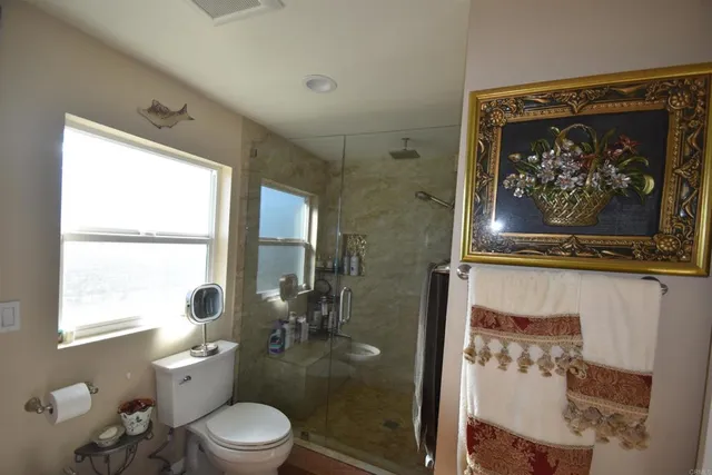 a bathroom with a sink double vanity and a toilet