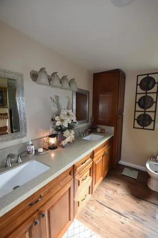 a bathroom with a sink toilet and shower