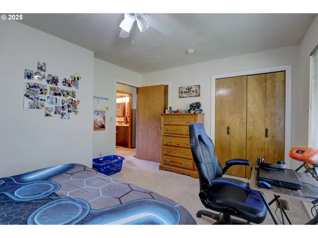 a view of a workspace with furniture and gym equipment