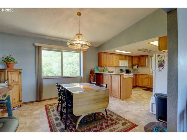 a dining room with furniture and window