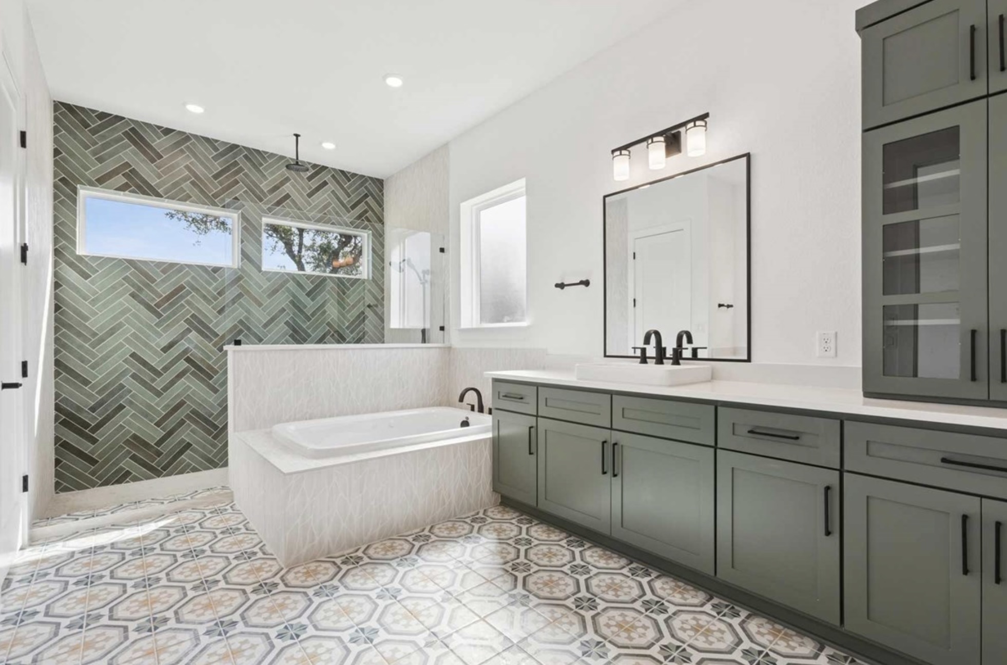 439 Vail River Road Dripping Springs, TX 78620 - Photo 12 of 20 a bathroom with a bathtub sink and mirror