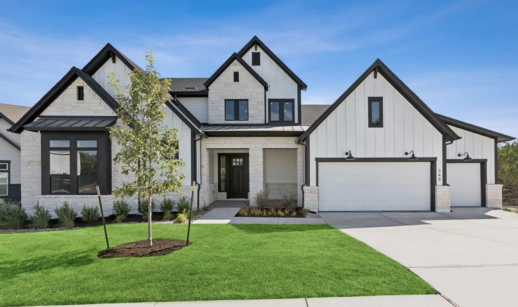 439 Vail River Road Dripping Springs, TX 78620 - Photo 18 of 20 a front view of a house with a yard and garage