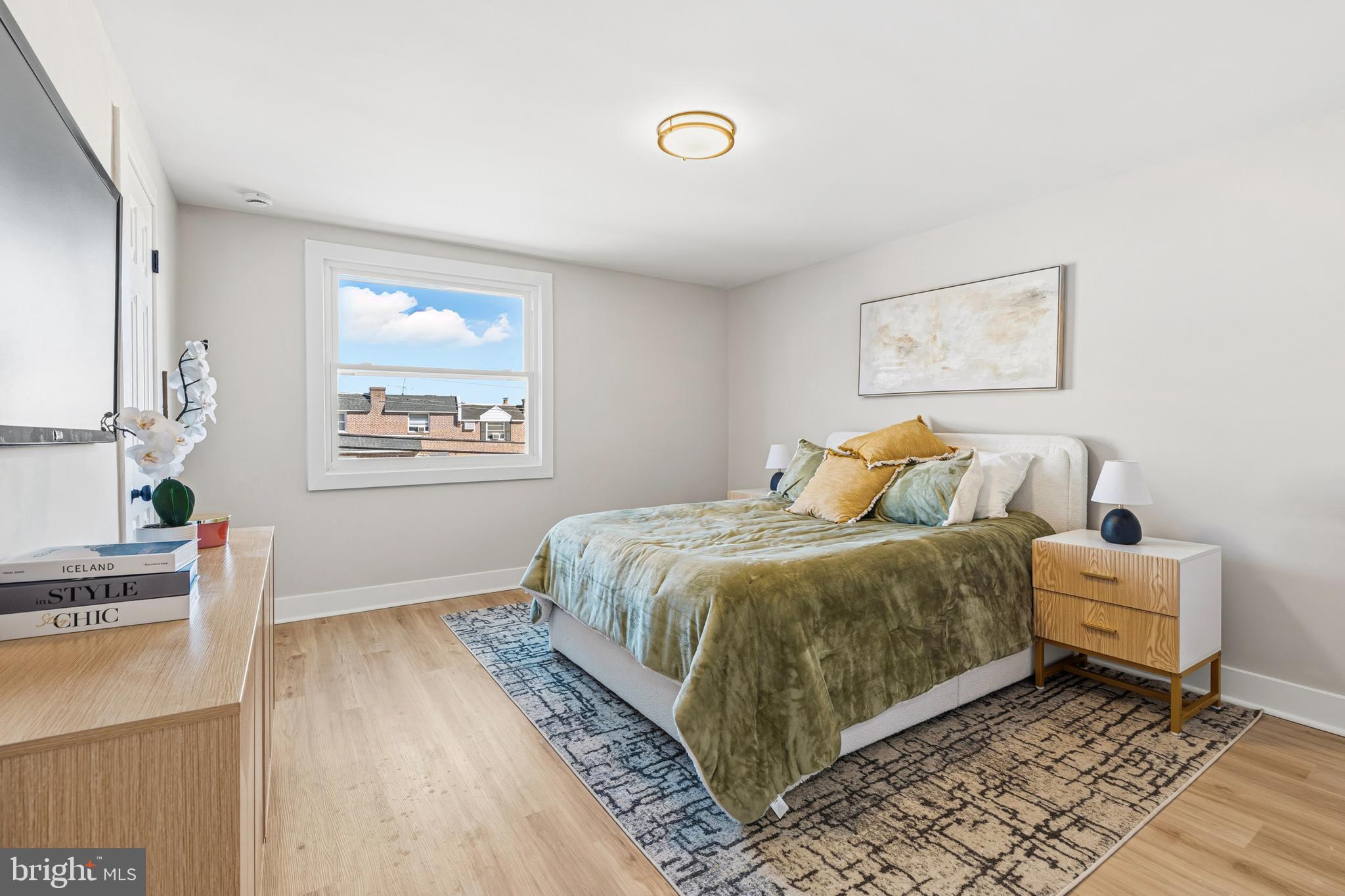 726 Grant Road Folcroft, PA 19032 - Photo 11 of 23 a spacious bedroom with a bed and a window