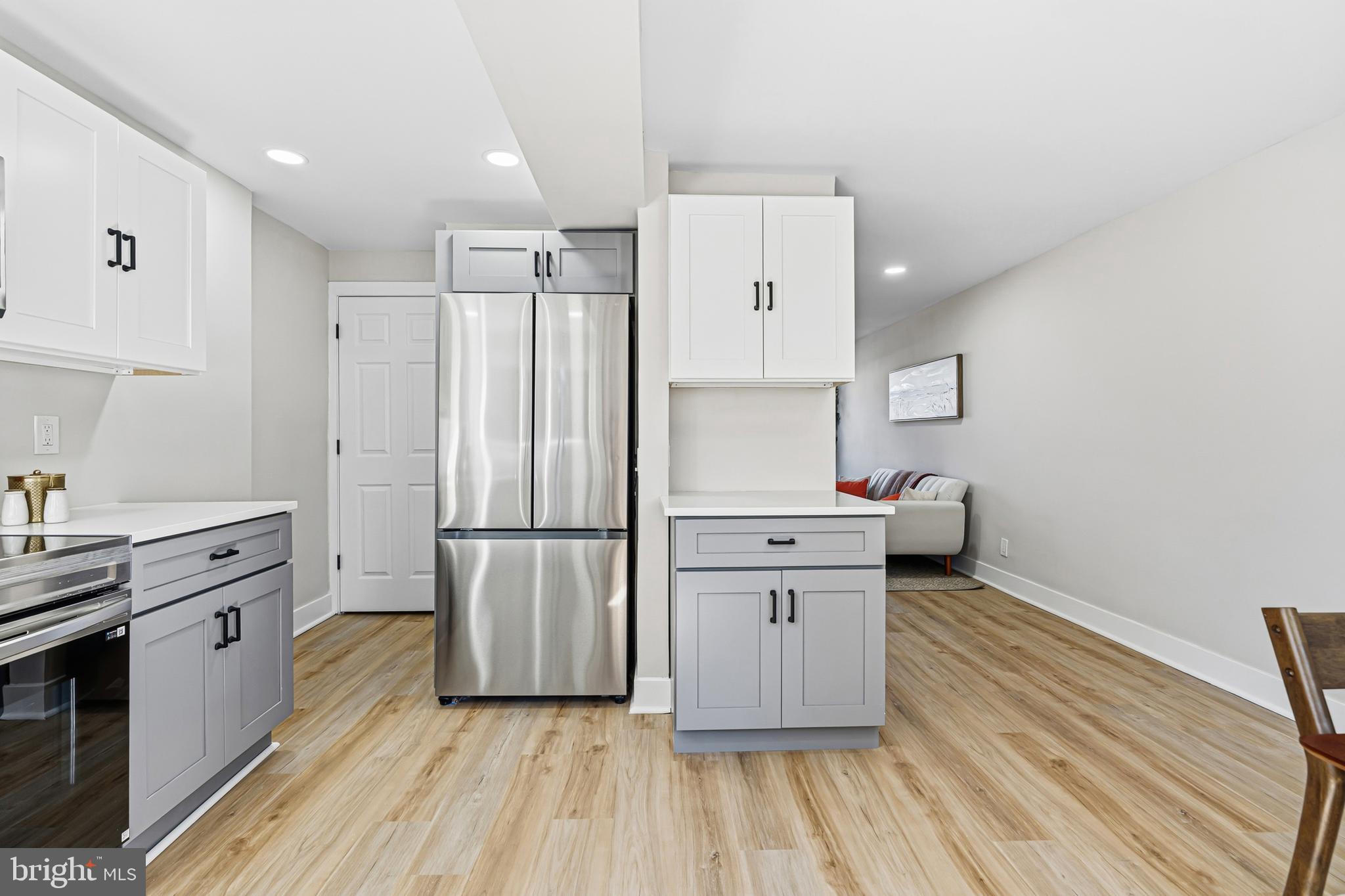 726 Grant Road Folcroft, PA 19032 - Photo 10 of 23 a kitchen with stainless steel appliances a refrigerator and a stove top oven