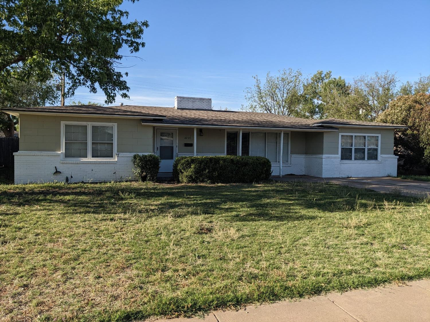 4009 44th Street Lubbock, TX 79413 - Photo 1 of 15 a front view of a house with a yard
