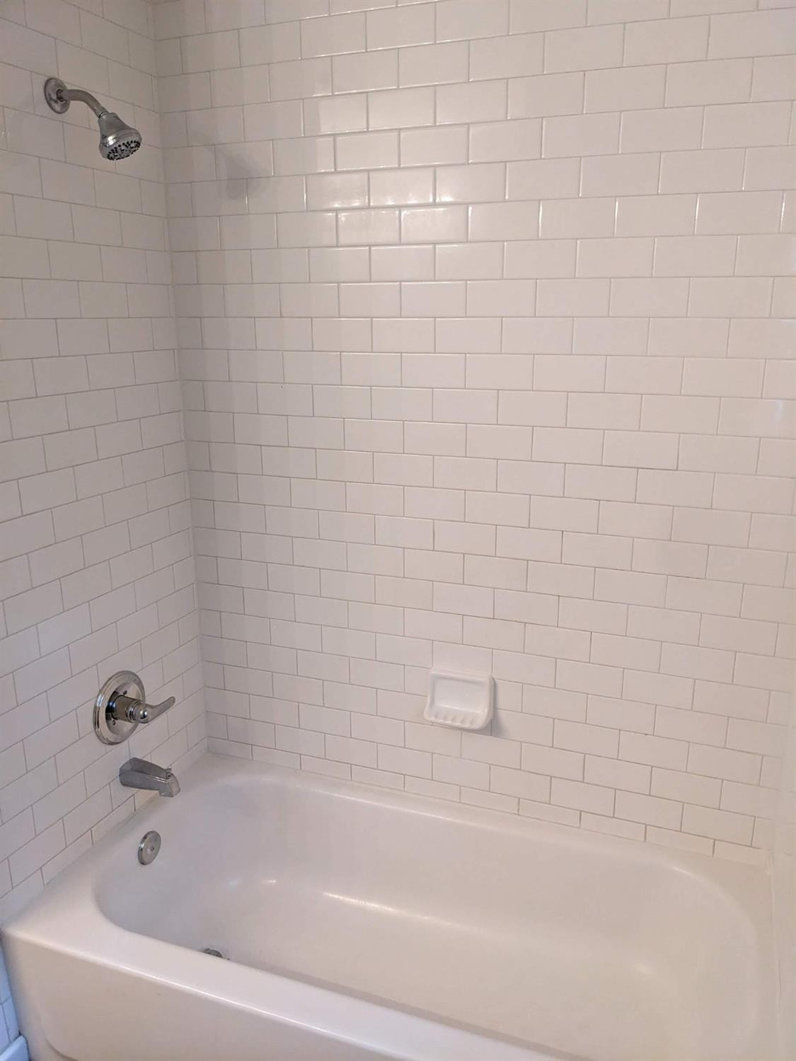 4009 44th Street Lubbock, TX 79413 - Photo 11 of 15 a bathroom with a bathtub