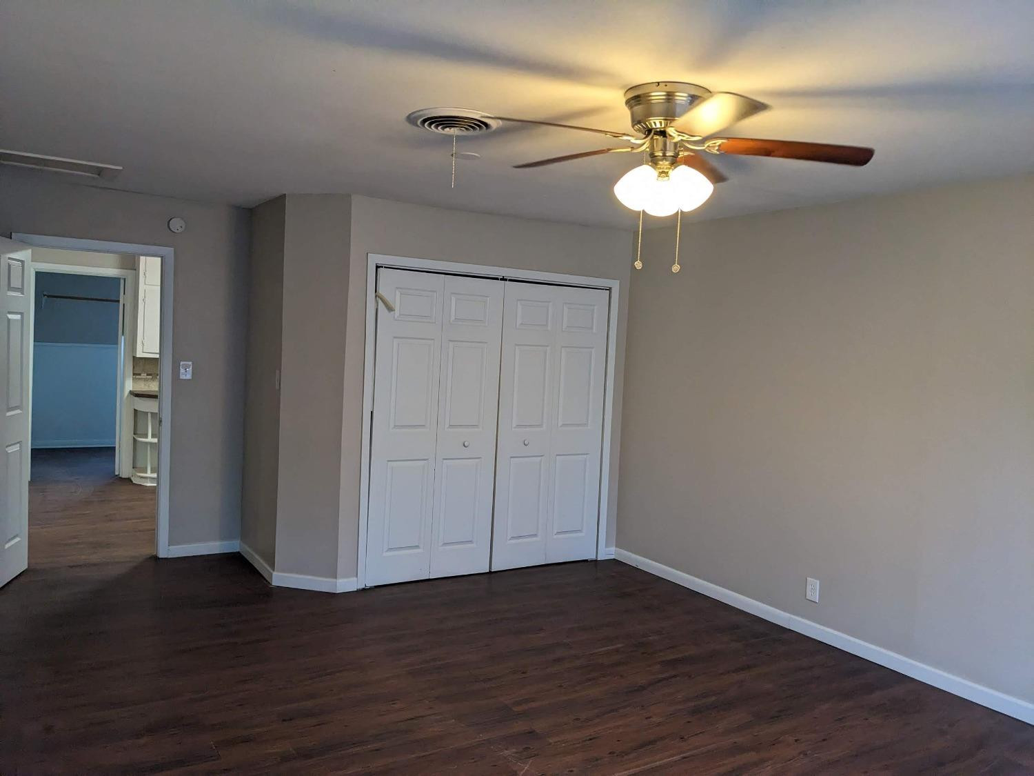 4009 44th Street Lubbock, TX 79413 - Photo 8 of 15 a view of a room with wooden floor fan and a window