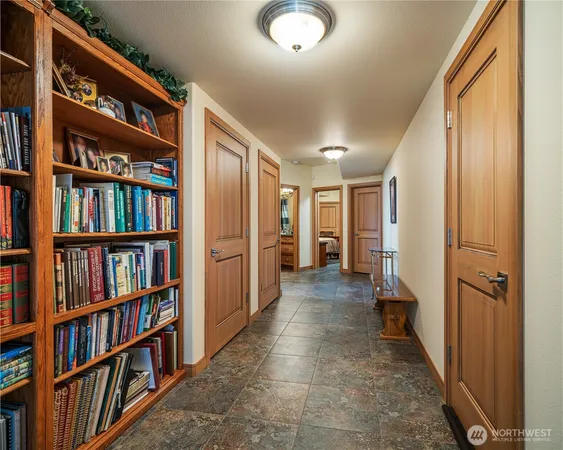 a hallway with bookshelf