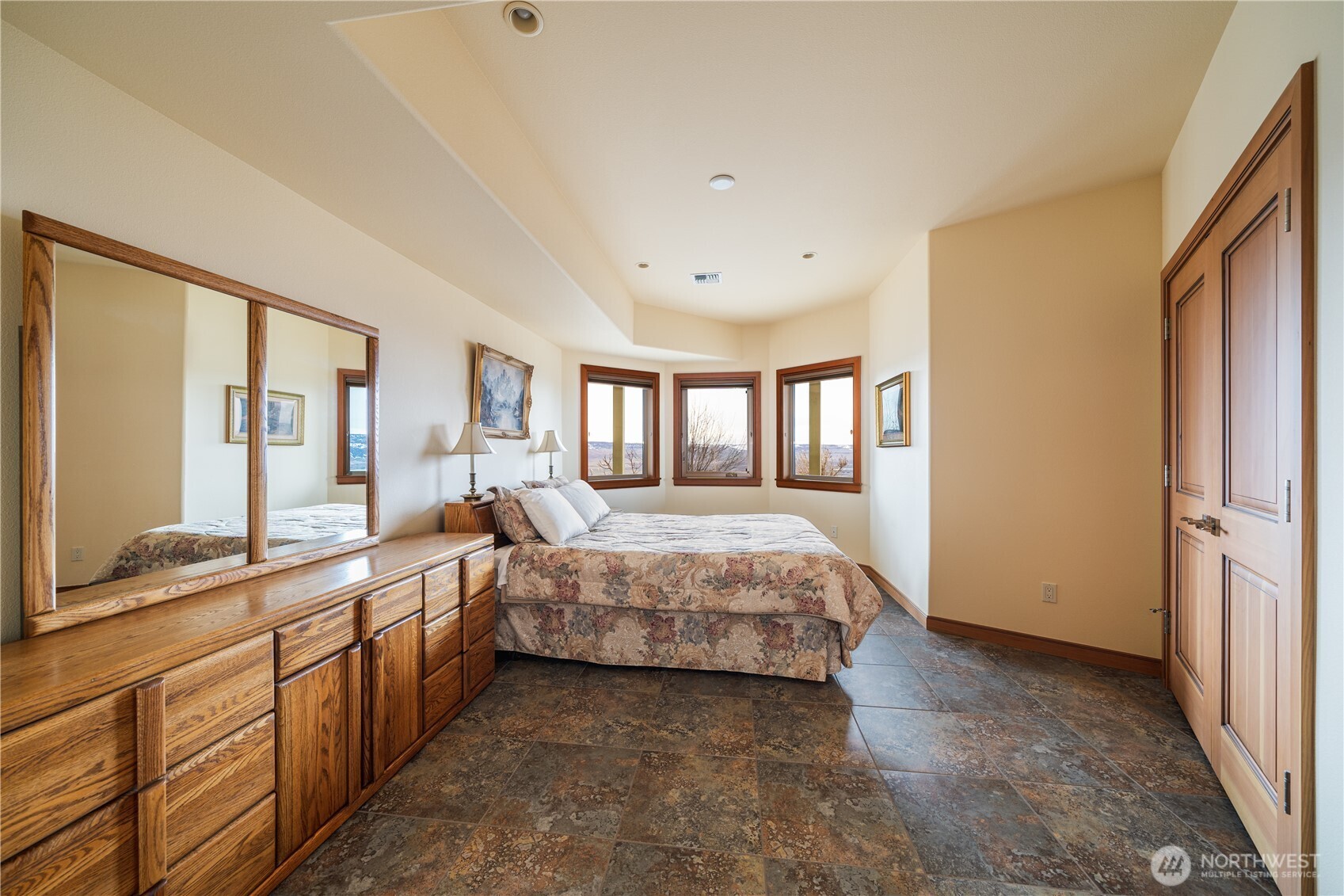 17 Vista Ridge Road Brewster, WA 98812 - Photo 26 of 40 a spacious bedroom with a large bed and a large window