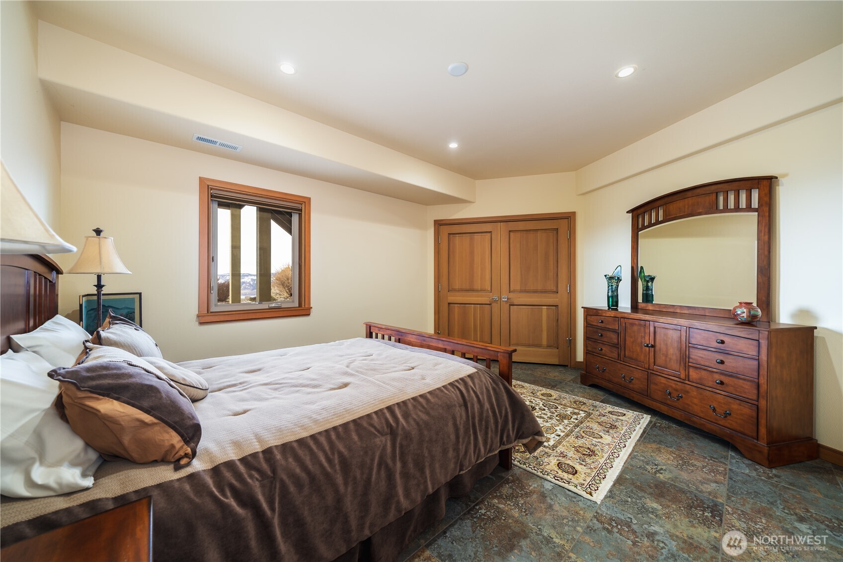 17 Vista Ridge Road Brewster, WA 98812 - Photo 27 of 40 a bedroom with a bed and a dresser