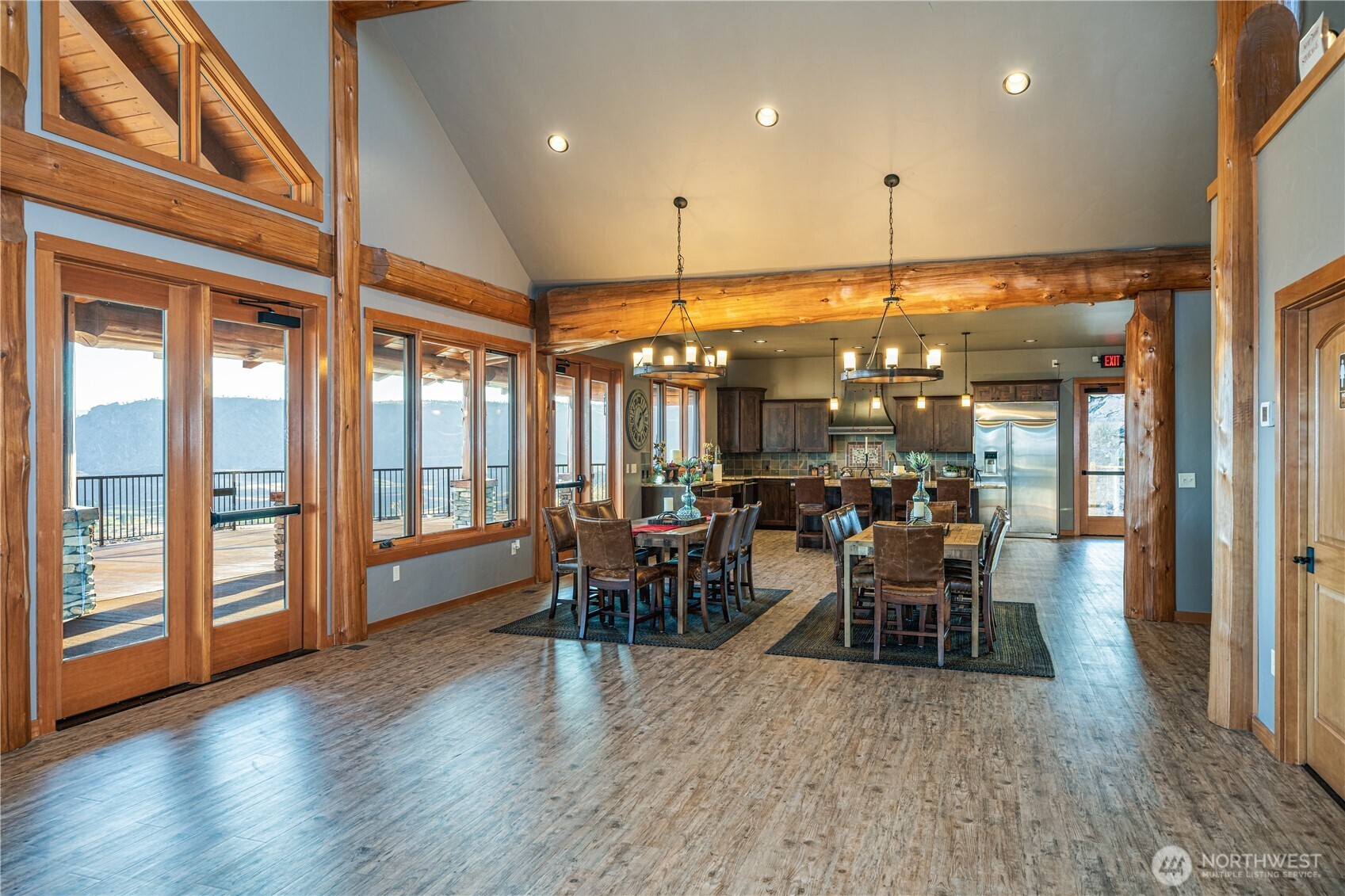 17 Vista Ridge Road Brewster, WA 98812 - Photo 35 of 40 a dining room with wooden floor ceiling fan and floor to ceiling window