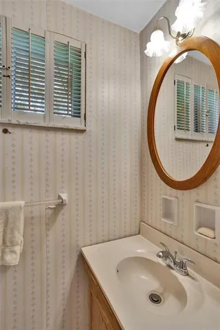 a bathroom with a sink and a mirror