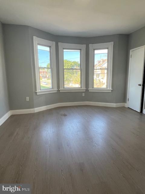 710 Main Street Darby, PA 19023 - Photo 12 of 20 an empty room with wooden floor and windows