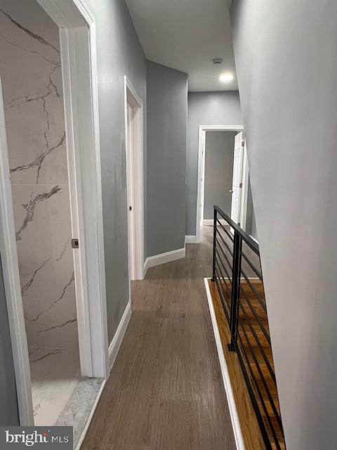 710 Main Street Darby, PA 19023 - Photo 13 of 20 a view of a hallway with wooden floor and staircase