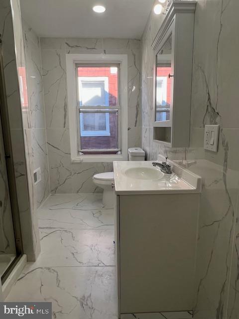 710 Main Street Darby, PA 19023 - Photo 14 of 20 a bathroom with a sink a toilet and a mirror